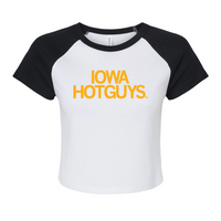 Two-tone baby tee with a white base and black collar and sleeves. Centered golden yellow text says, 'IOWA HOTGUYS."