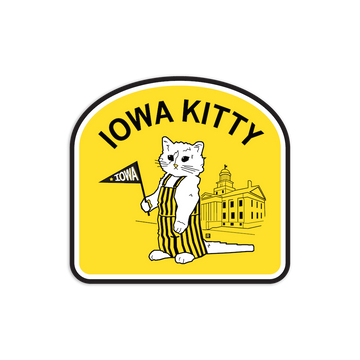RAYGUN vinyl sticker featuring a cat in striped overalls holding an Iowa pennant in front of the Old Capitol Building, with the text IOWA KITTY.