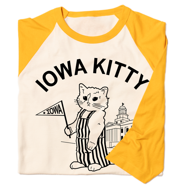 A folded off-white baseball t-shirt with gold 3/4 sleeves that says 