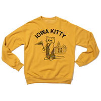 A yellow crew sweatshirt that says "Iowa Kitty" in black curved font over an image of RAYGUN's cat mascot, Gary, wearing striped overalls and holding a small Iowa flag in front of the old capitol building in Iowa City.