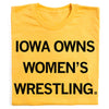 Yellow RAYGUN t-shirt with the text IOWA OWNS WOMENS WRESTLING printed in black letters.