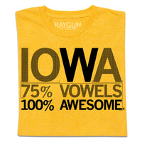 A folded heather yellow t-shirt with centered black print that says, "Iowa
75% Vowels
100% Awesome"