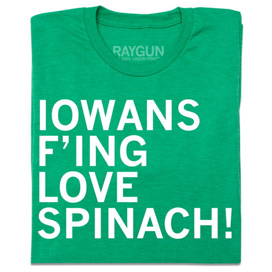 A folded heather kelly green t-shirt with left-aligned white ink text that reads "Iowans f'ing love spinach!"