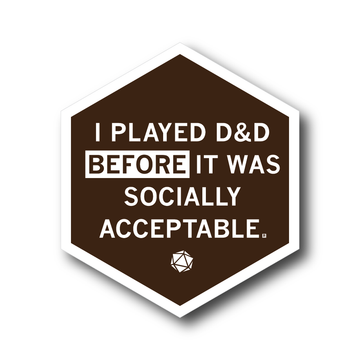 Hexagonal vinyl sticker that reads, I PLAYED D&D BEFORE IT WAS SOCIALLY ACCEPTABLE, featuring a small 20-sided die icon at the bottom.
