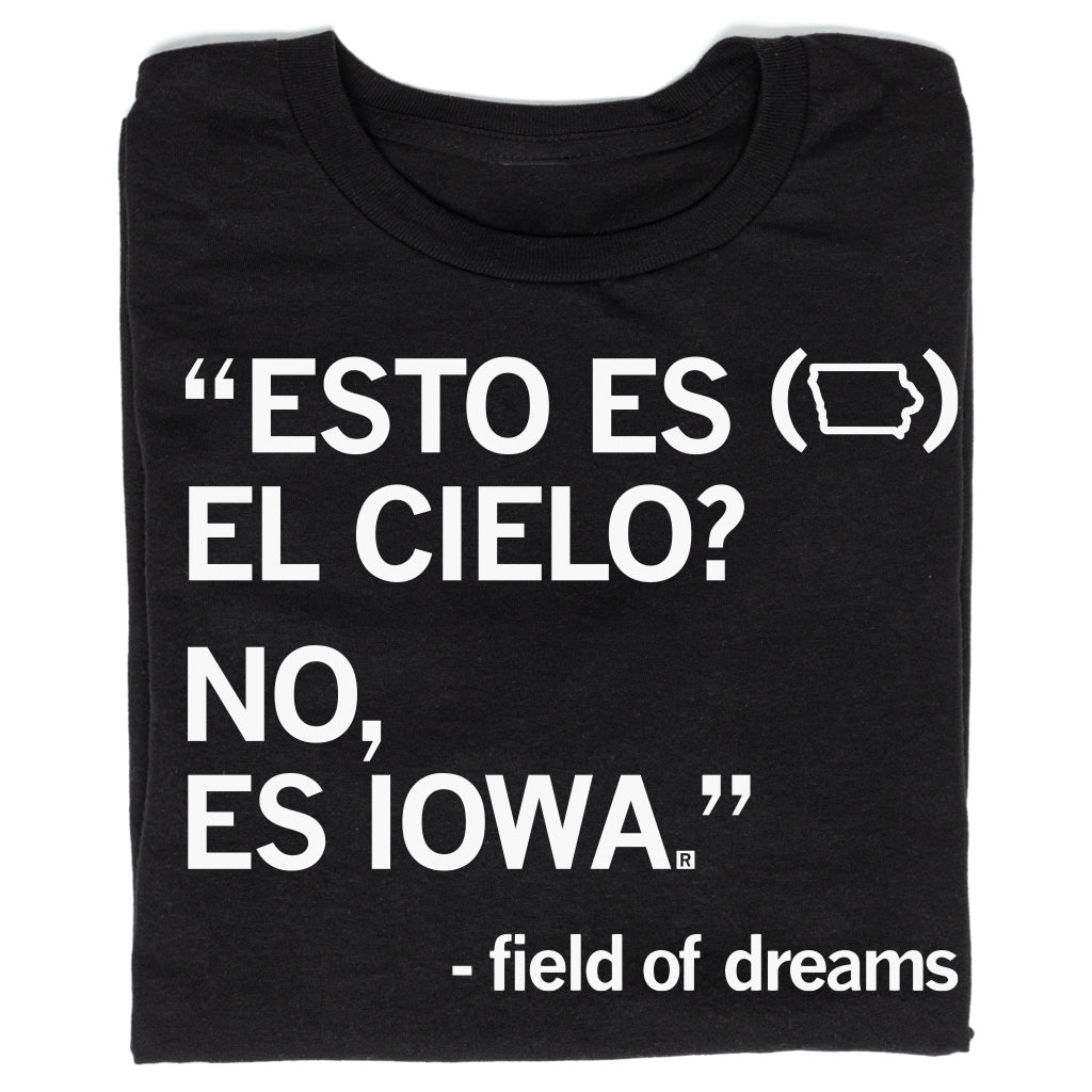 Black Raygun t-shirt with white text reading ESTO ES (Iowa shape outline) EL CIELO? NO, ES IOWA, followed by Field of Dreams at the bottom.