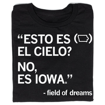 Black Raygun t-shirt with white text reading ESTO ES (Iowa shape outline) EL CIELO? NO, ES IOWA, followed by Field of Dreams at the bottom.