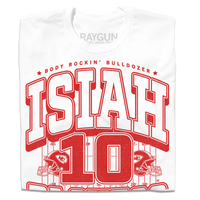 A folded white t-shirt with red ink that reads "The Body Rockin' Bulldozer, Isiah Pachecho #10. The ground hates to see him running" over an illustration of a football field with a football helmet to either side.