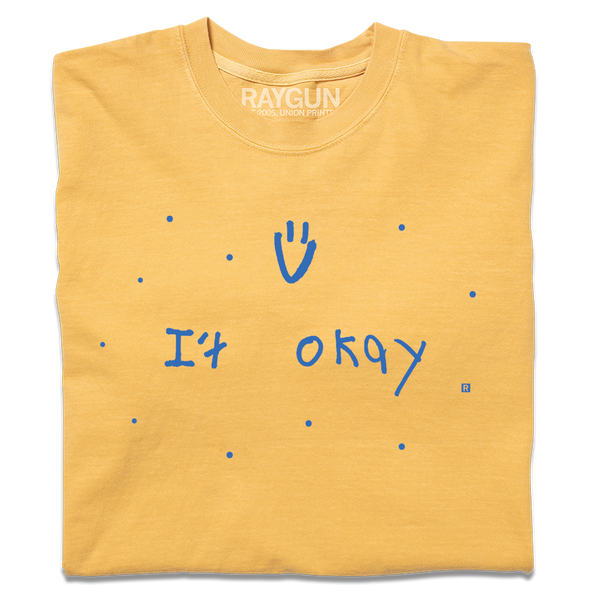A folded heavyweight yellow t-shirt with blue print that says, 