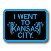 Rectangular black sticker with a bright blue border and text that says, "I WENT TO KANSAS CITY" with water fountain logos from the city flag to either side.