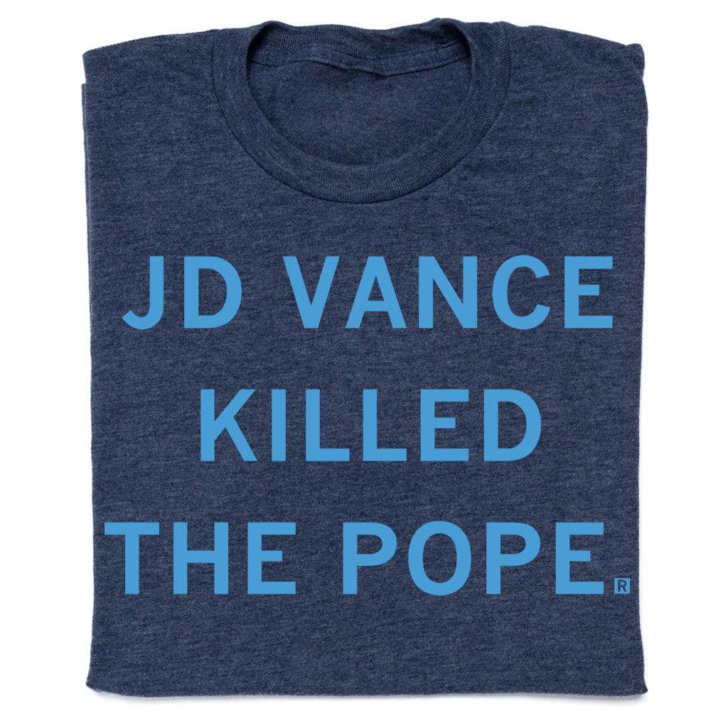 A heather denim t-shirt with the text JD VANCE KILLED THE POPE printed in light blue capital letters.