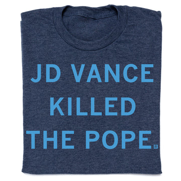 A heather denim t-shirt with the text JD VANCE KILLED THE POPE printed in light blue capital letters.
