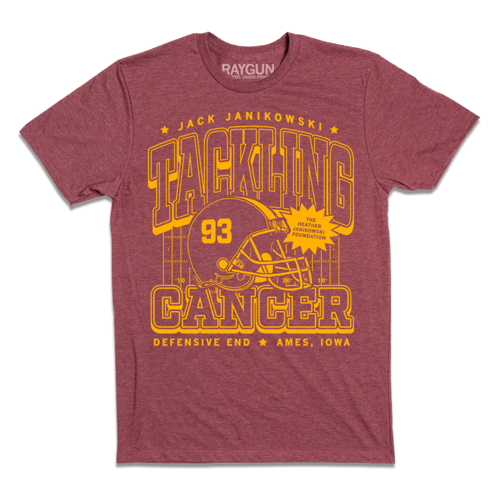 Heather maroon t-shirt with gold ink laid out like a vintage sports jersey. Text reads "Jack Janikowski. Tacking cancer. The Heather Janikowski Foundation. Defensive End. Ames, Iowa."
