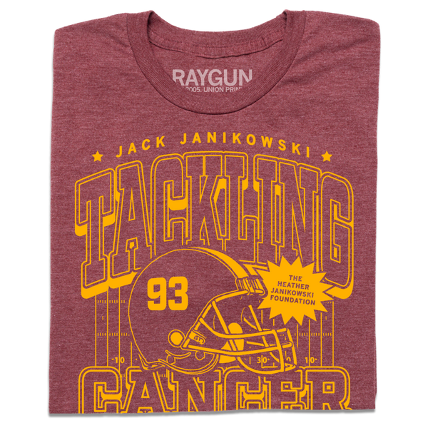A folded heather burgundy t-shirt with gold ink laid out like a vintage sports jersey. Text reads 