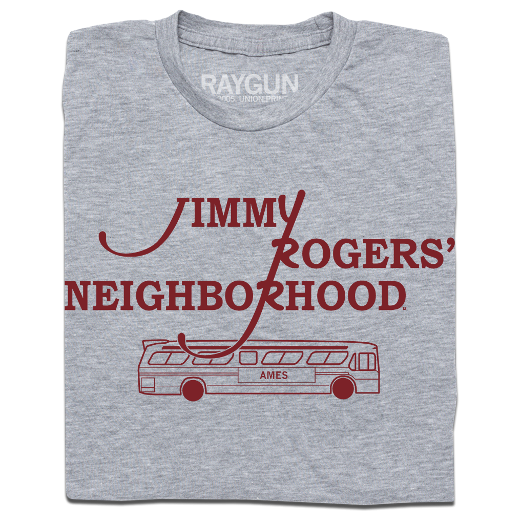 A folded heather grey shirt with cardinal ink that reads "Jimmy Rodger's Neighborhood" over an illustration of a bus with "Ames" printed on the side.