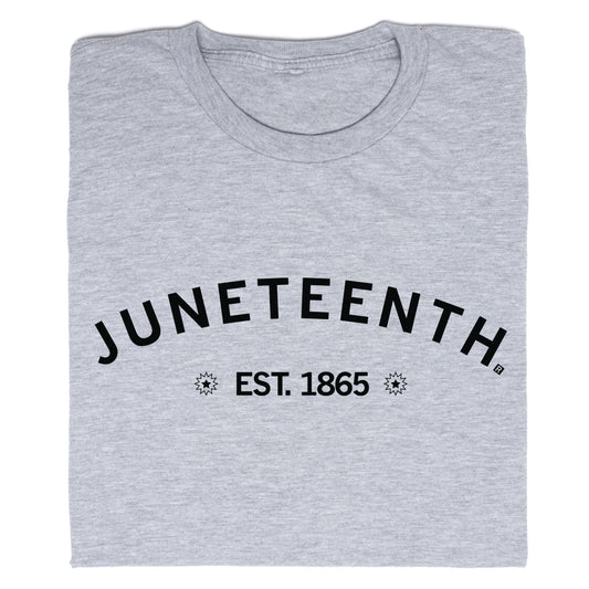 Folded grey RAYGUN crew-neck t-shirt with JUNETEENTH printed in a black arch above EST. 1865, flanked by starburst icons.