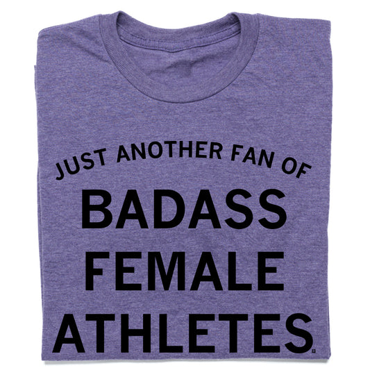 A sweatshop-free purple t-shirt featuring the black text JUST ANOTHER FAN OF BADASS FEMALE ATHLETES.