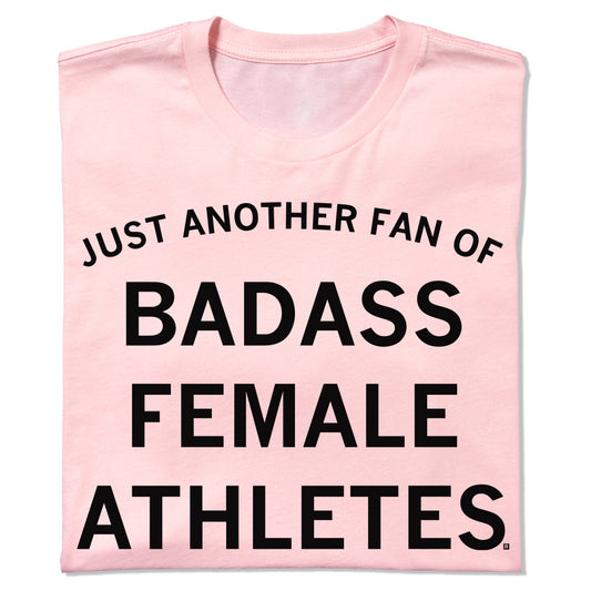 Light pink union-made t-shirt with the text JUST ANOTHER FAN OF BADASS FEMALE ATHLETES printed in black.