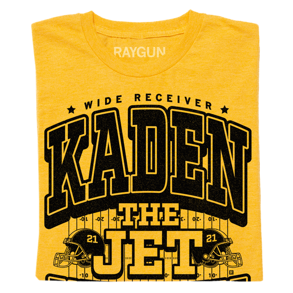 A folded yellow shirt with black text that says, 