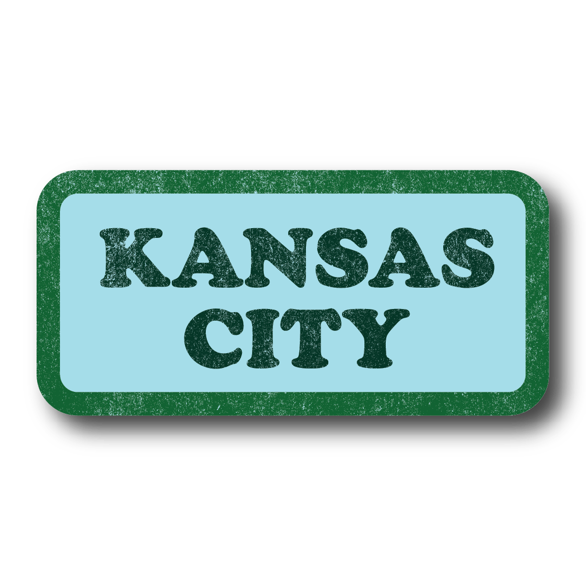 Pastel blue rectangular sticker with green border and dark green text in a vintage, faded style that says, "KANSAS CITY"