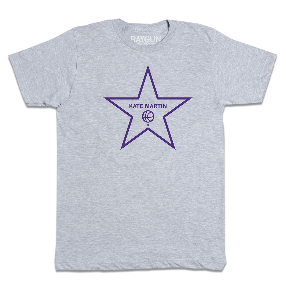 A heather grey t-shirt with purple ink depicting a Hollywood start that says, "Kate Martin" above a basketball.