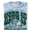 Light blue, garment-dyed, acid-wash collegiate t-shirt with a graphic that reads Protect Our Planet and Keep It in large green letters above a line drawing of Earth, with small illustrations of planets labeled Earth and Uranus.
