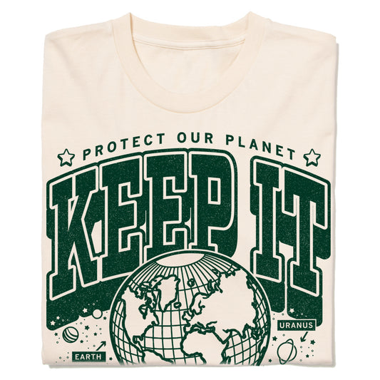 Cream-colored sustainable t-shirt with a green graphic that says PROTECT OUR PLANET and KEEP IT above an illustration of the globe, including small labels for EARTH and URANUS.