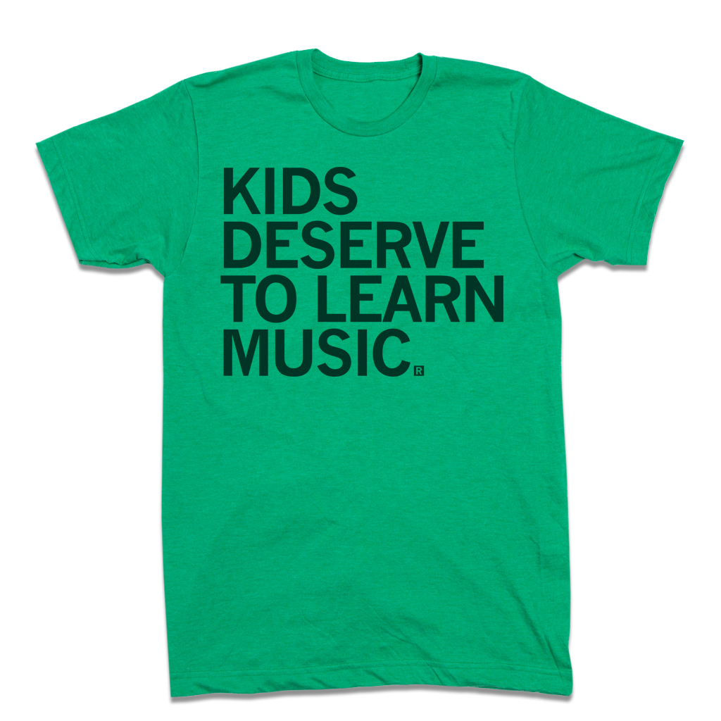 Green heather kelly t-shirt with the black text KIDS DESERVE TO LEARN MUSIC.