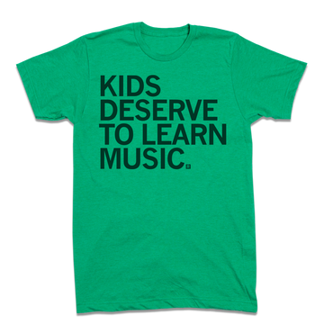 Green heather kelly t-shirt with the black text KIDS DESERVE TO LEARN MUSIC.