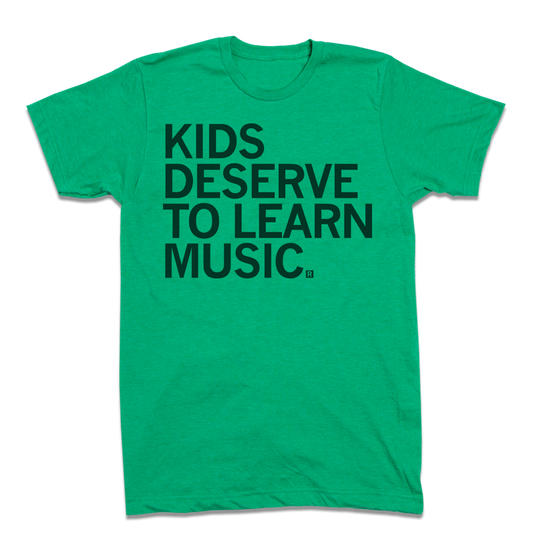 Green heather kelly t-shirt with the black text KIDS DESERVE TO LEARN MUSIC.