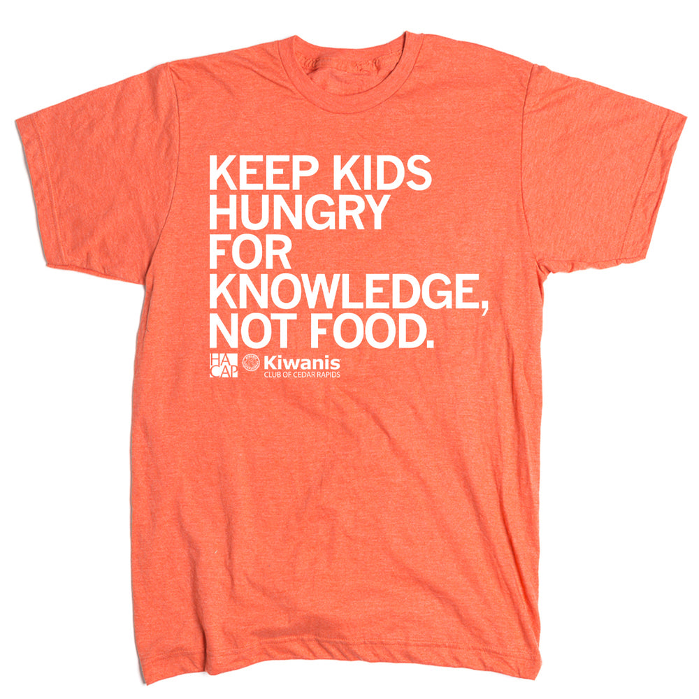 Short sleeve heather orange t-shirt with left aligned white text that says, "Keep kids hungry for knowledge, not food" with the HACAP and Kiwanis Club of Cedar Rapids logos in the bottom left.