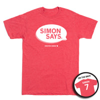 Heather red shirt that depicts a speech bubble in white ink that reads "Simon Says" and has "Kristen Simon" at the bottom along with "Simon 7" on the back.