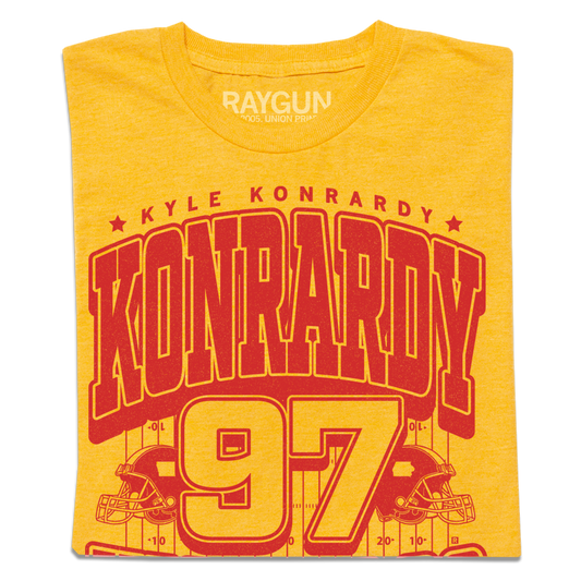 Heather Mellow Yellow t-shirt featuring a red graphic with the name Kyle Konrardy, the surname in large letters, and the number 97 above an illustration of a football field.
