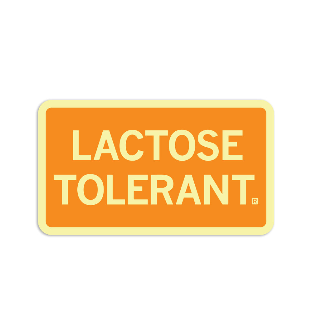 Butter and gold rectangular sticker that reads "lactose tolerant"