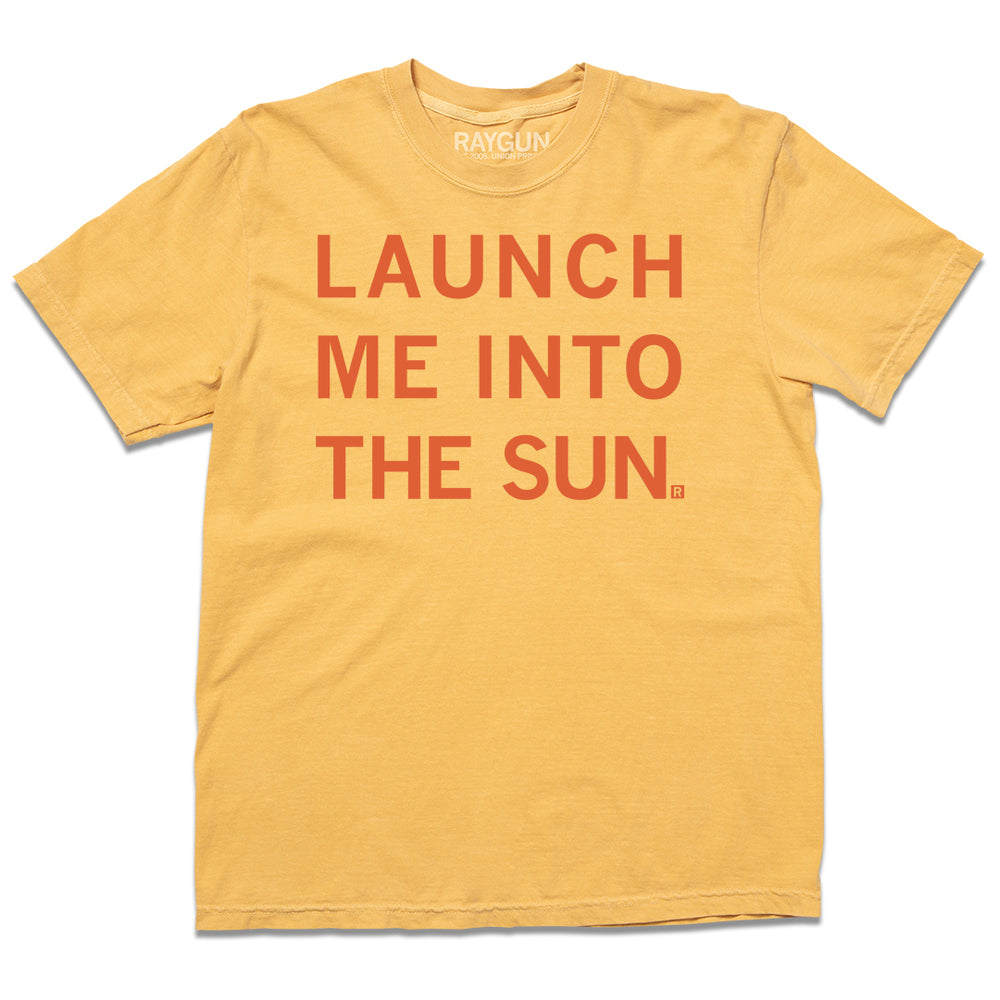 A mustard heavyweight shirt with orange ink that reads "launch me into the sun."