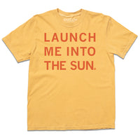 A mustard heavyweight shirt with orange ink that reads "launch me into the sun."