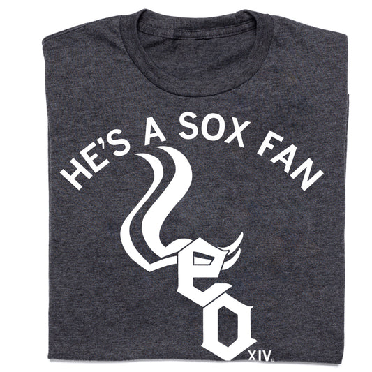 Charcoal crew neck T-shirt featuring the white text HES A SOX FAN arched over a stylized logo combining the Chicago White Sox emblem with the letters LEO.