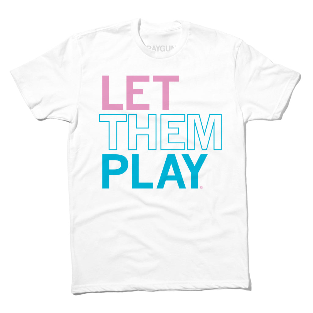 White t-shirt with the text LET THEM PLAY printed in pink and blue, supporting the message that trans folks play sports.