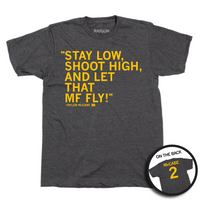 A heather charcoal t-shirt with gold ink text on the front that says, "Stay low, shoot high, and let that MF fly!" - Taylor McCabe." and the back is laid out like a jersey with "McCabe 2."
