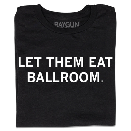 A folded black t-shirt with white ink text that says, "Let Them Eat Ballroom"
