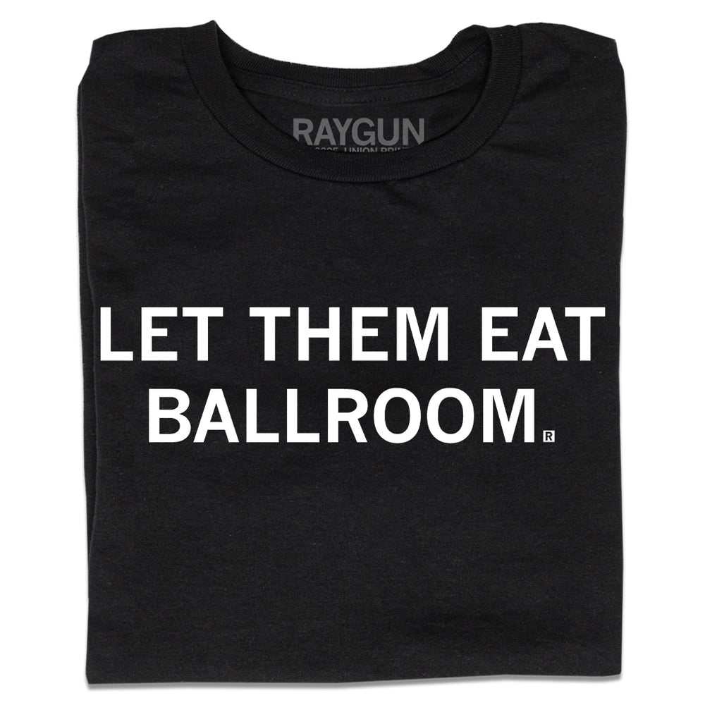 A folded black t-shirt with white ink text that says, "Let Them Eat Ballroom"