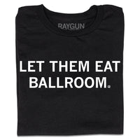 A folded black t-shirt with white ink text that says, "Let Them Eat Ballroom"