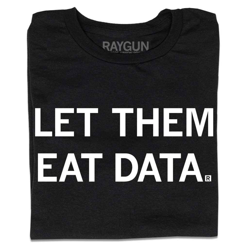 A folded black t-shirt with all caps white text that says, "Let Them Eat Data."