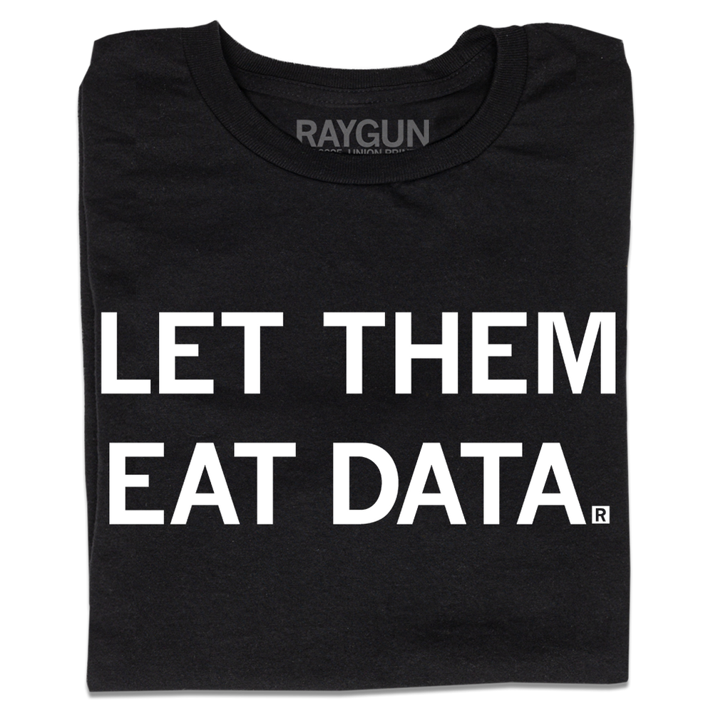 A folded black t-shirt with all caps white text that says, "Let Them Eat Data."