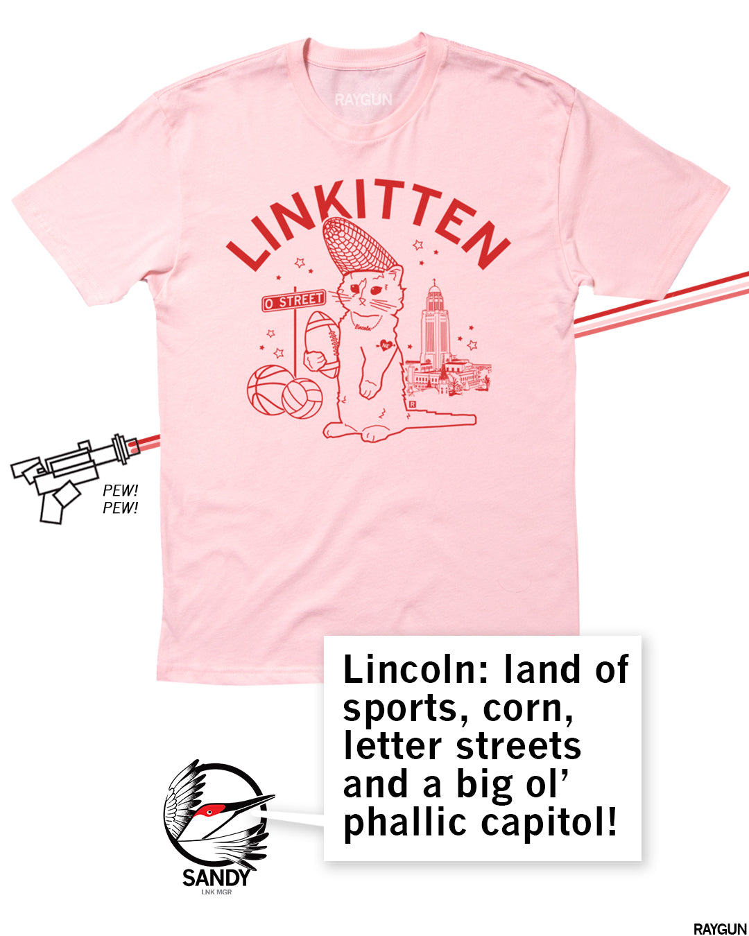 Pink t-shirt with a red graphic of a cat wearing a corn cob hat, holding a football, near a street sign labeled O Street, a basketball, and a capitol building, with the text LINKITTEN above and a speech bubble describing Lincoln, Nebraska.