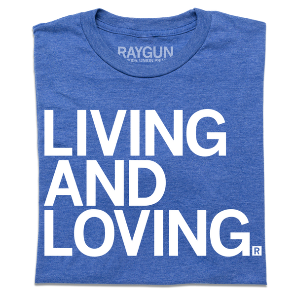 A folded heather royal blue t-shirt with large, left-aligned white ink text that reads 