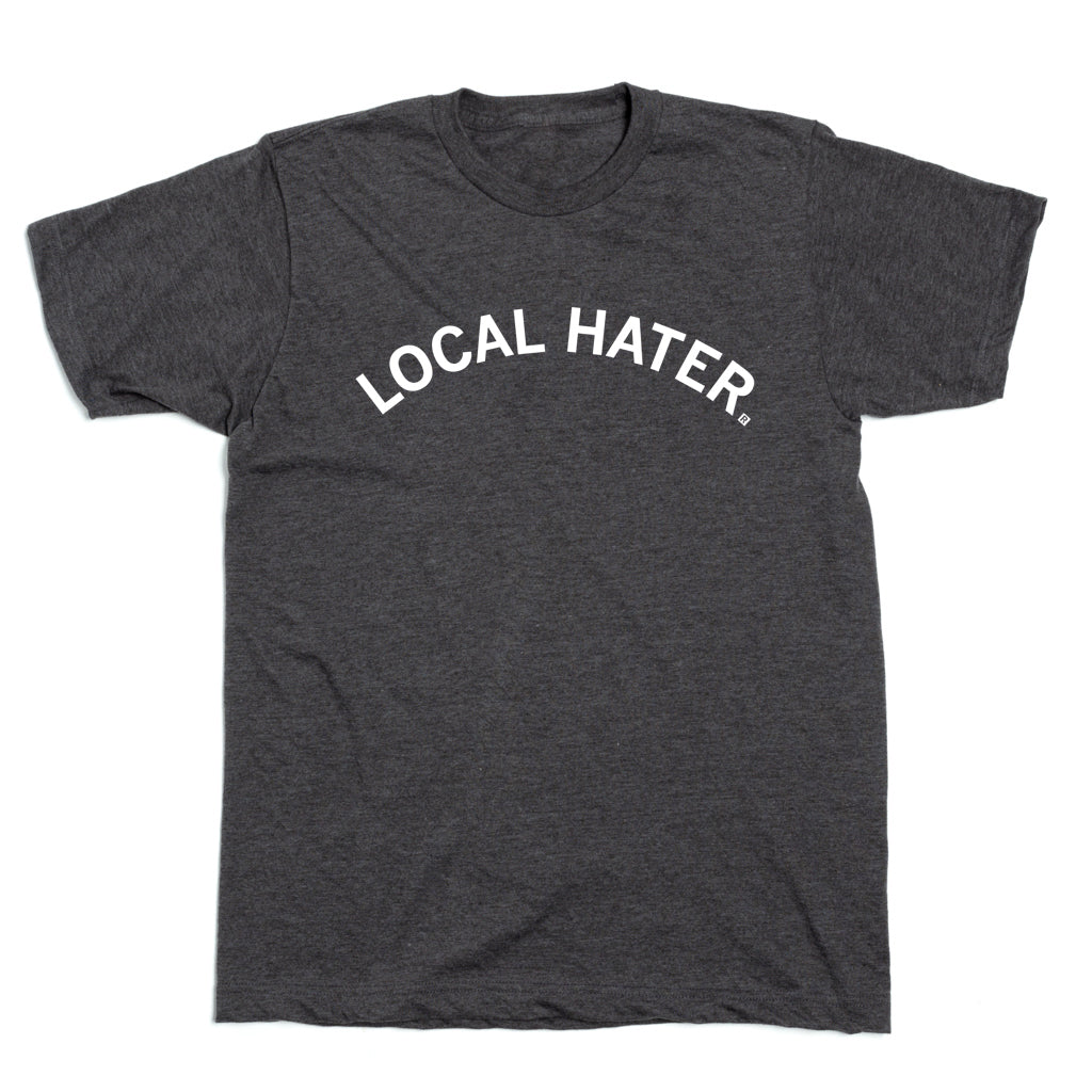 Charcoal gray RAYGUN t-shirt with the text LOCAL HATER printed in white across the chest.