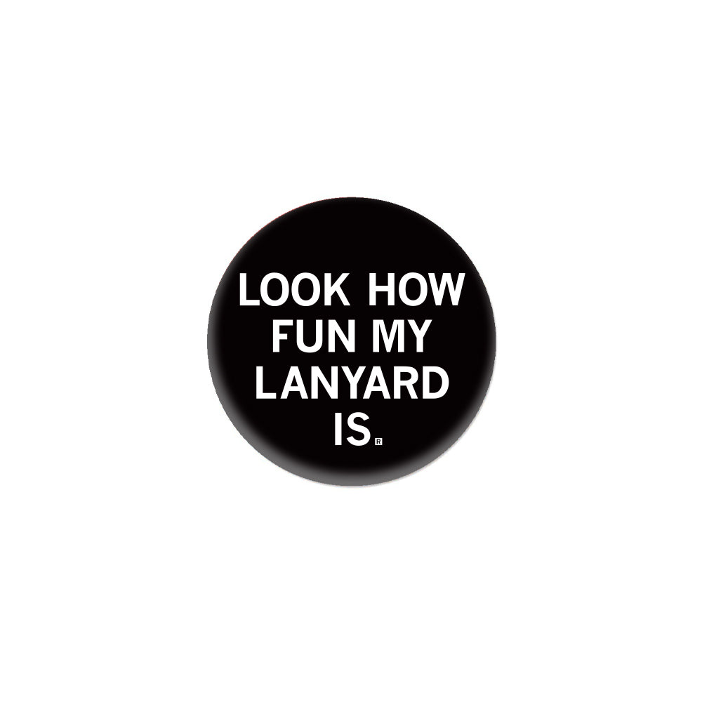 Black circular RAYGUN button featuring the white text, LOOK HOW FUN MY LANYARD IS.