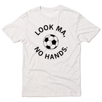 A triblend heather white t-shirt with black ink. An illustrated soccer ball in the center is surrounded by curved text that reads "Look ma, no hands."
