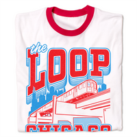Folded white ringer shirt with red collar and sleeve accents. Red and blue ink depicts the Chicago L train in front of the city skyline. Red text with blue outline reads "The Loop, Chicago. Live, laugh. loop."