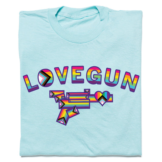 Heather purist blue Lovegun T-shirt featuring the word LOVEGUN above a stylized gun graphic, both in rainbow pride and progress pride flag color schemes.